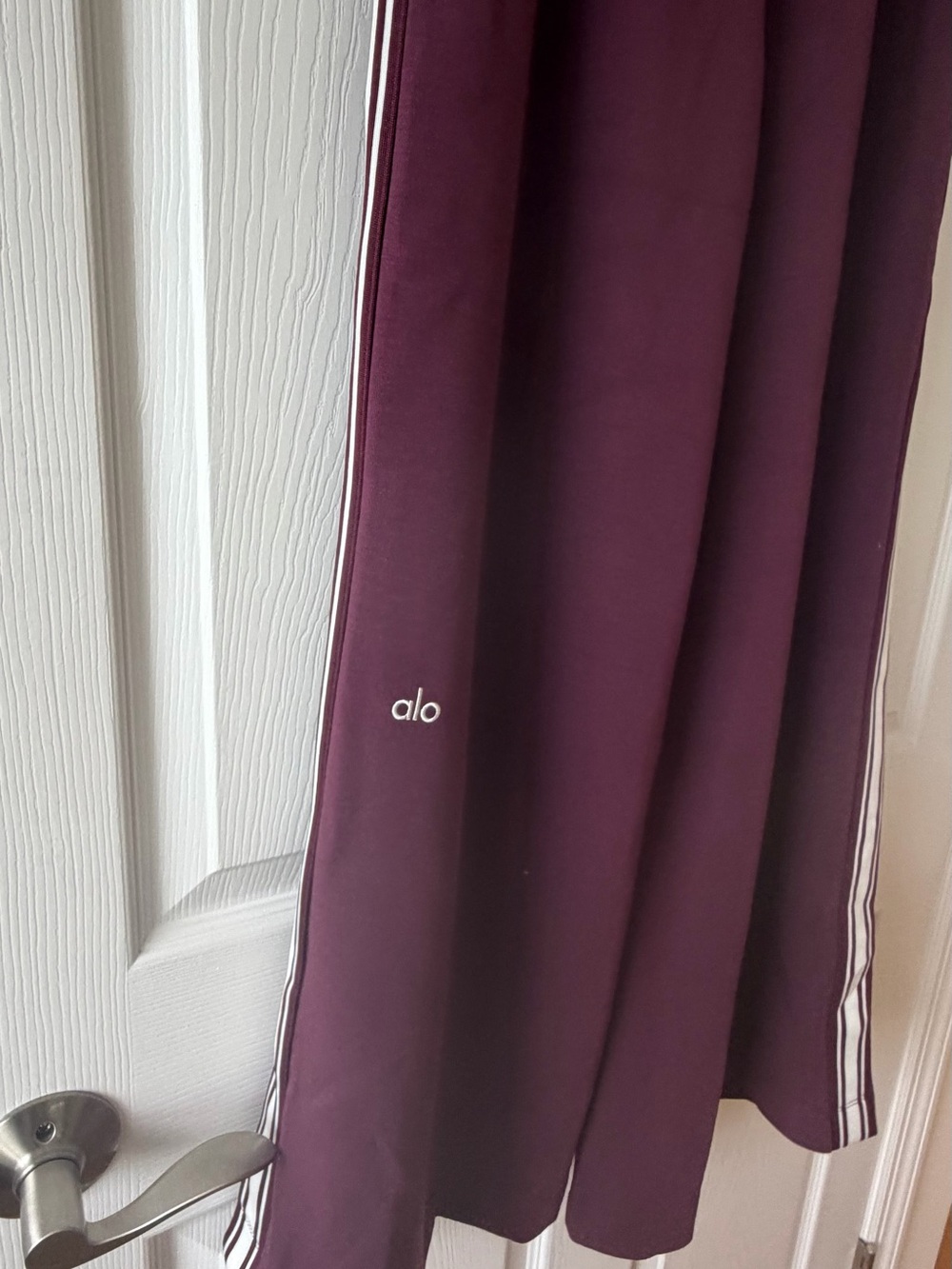 ALO Yoga Wide-Leg Track Pants in Plum with White Side Stripes - Picture 4 of 10